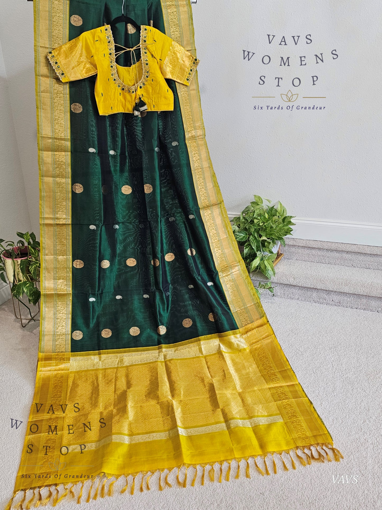 Green and yellow saree with blouse on a white background, branded 'VAVS WOMENS STOP'.