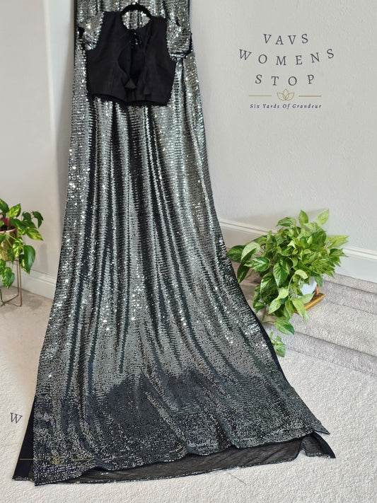 Elegant Black Net Saree adorned with shimmering silver sequins, paired with a designer blouse (size 36, extendable up to 42). Perfect for cocktail parties, receptions & evening events. Ready to ship.