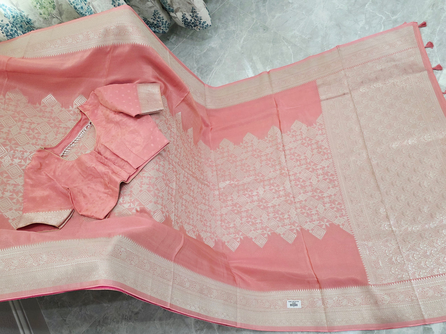 Pastel Coral Rose Soft Tissue Saree with Subtle Gold Geometry Center Design & Stitched Blouse