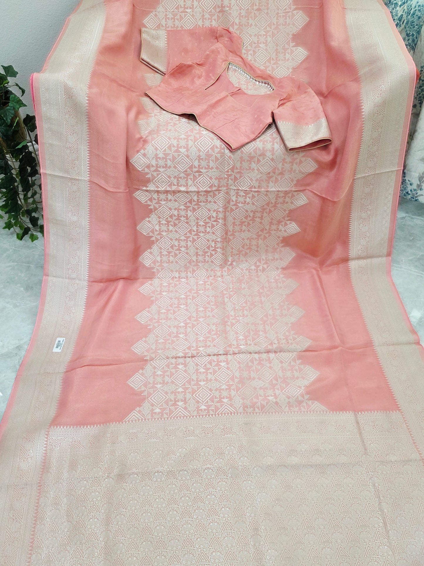 Pastel Coral Rose Soft Tissue Saree with Subtle Gold Geometry Center Design & Stitched Blouse
