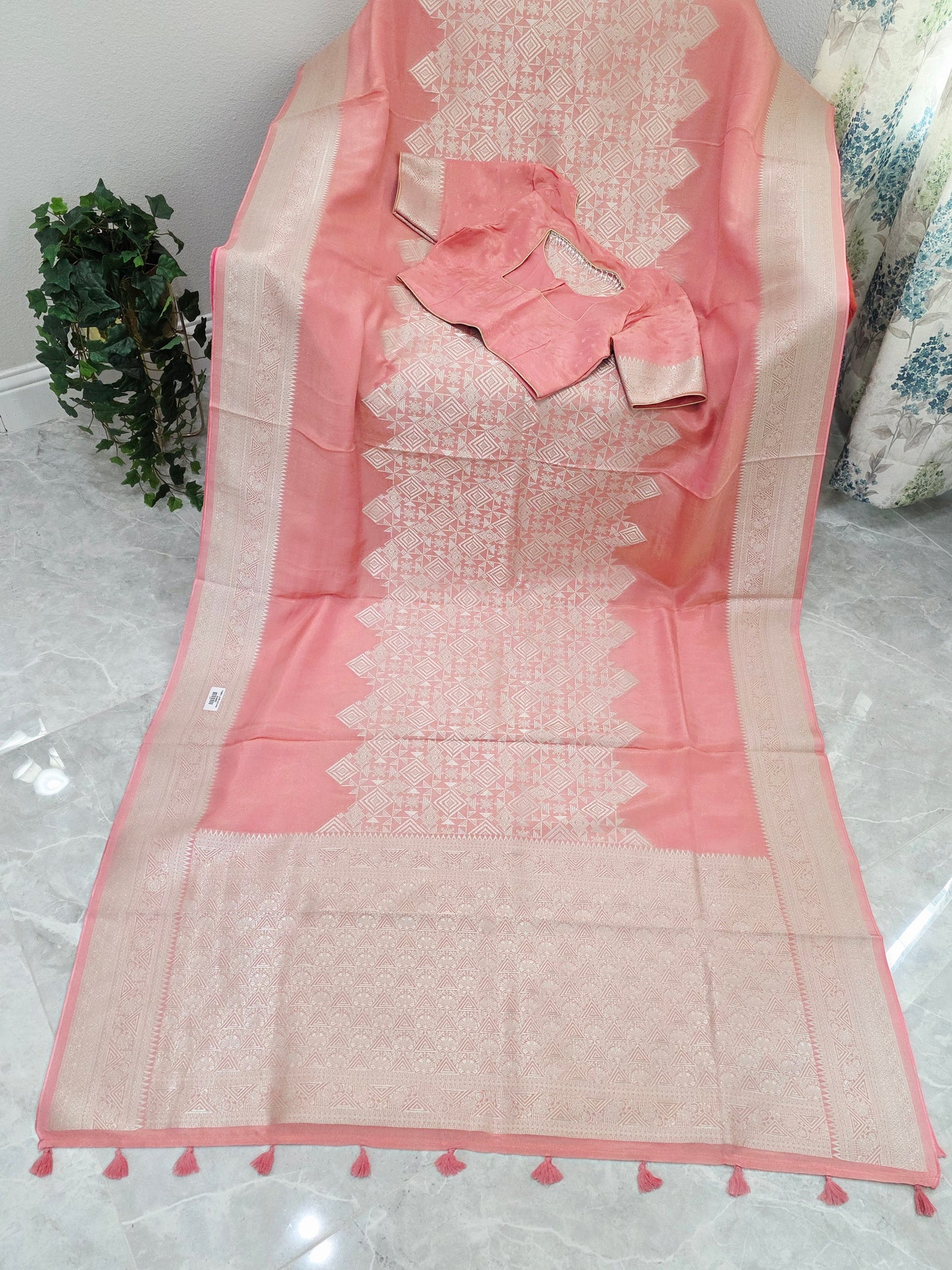 Pastel Coral Rose Soft Tissue Saree with Subtle Gold Geometry Center Design & Stitched Blouse