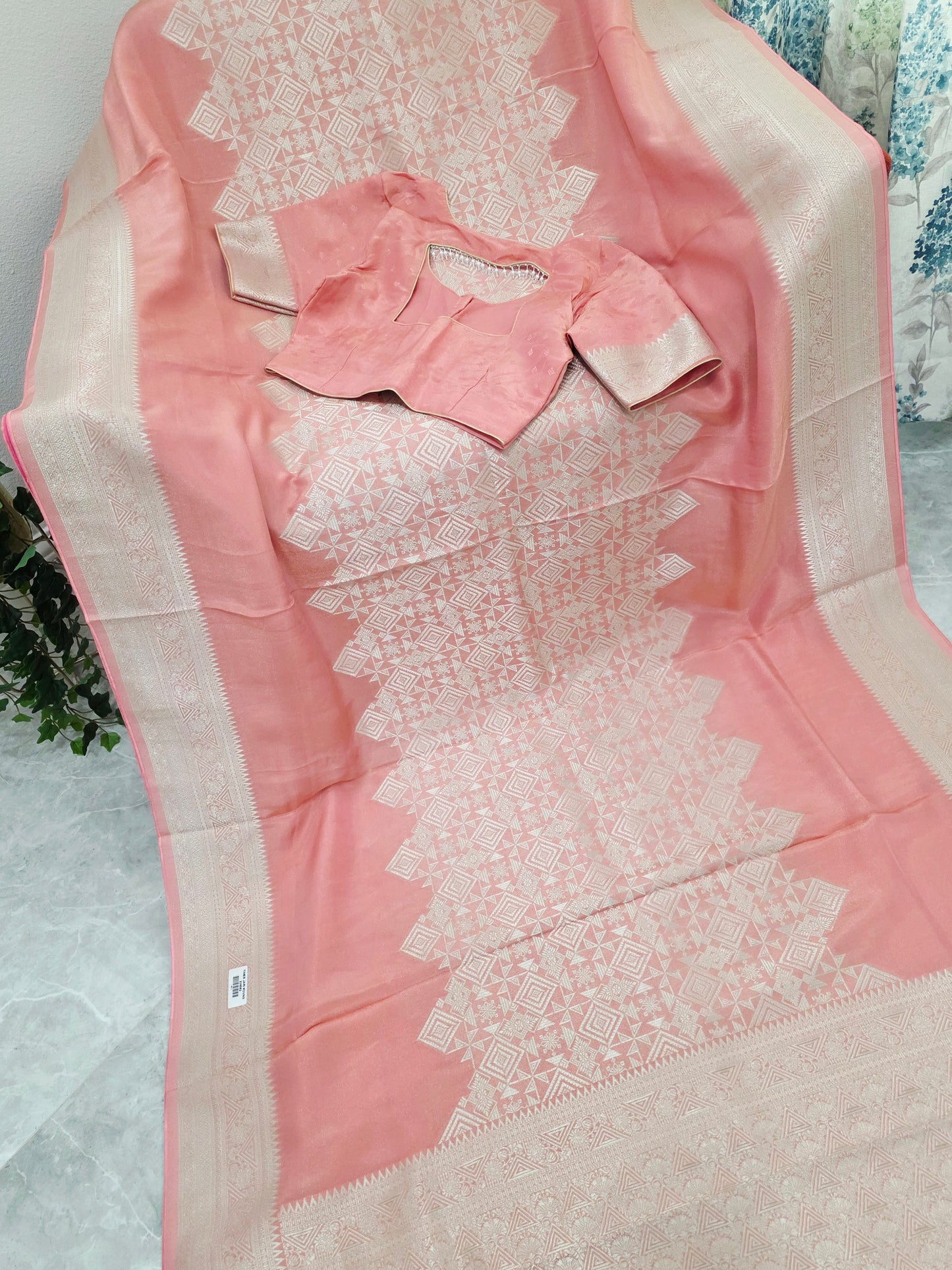 Pastel Coral Rose Soft Tissue Saree with Subtle Gold Geometry Center Design & Stitched Blouse