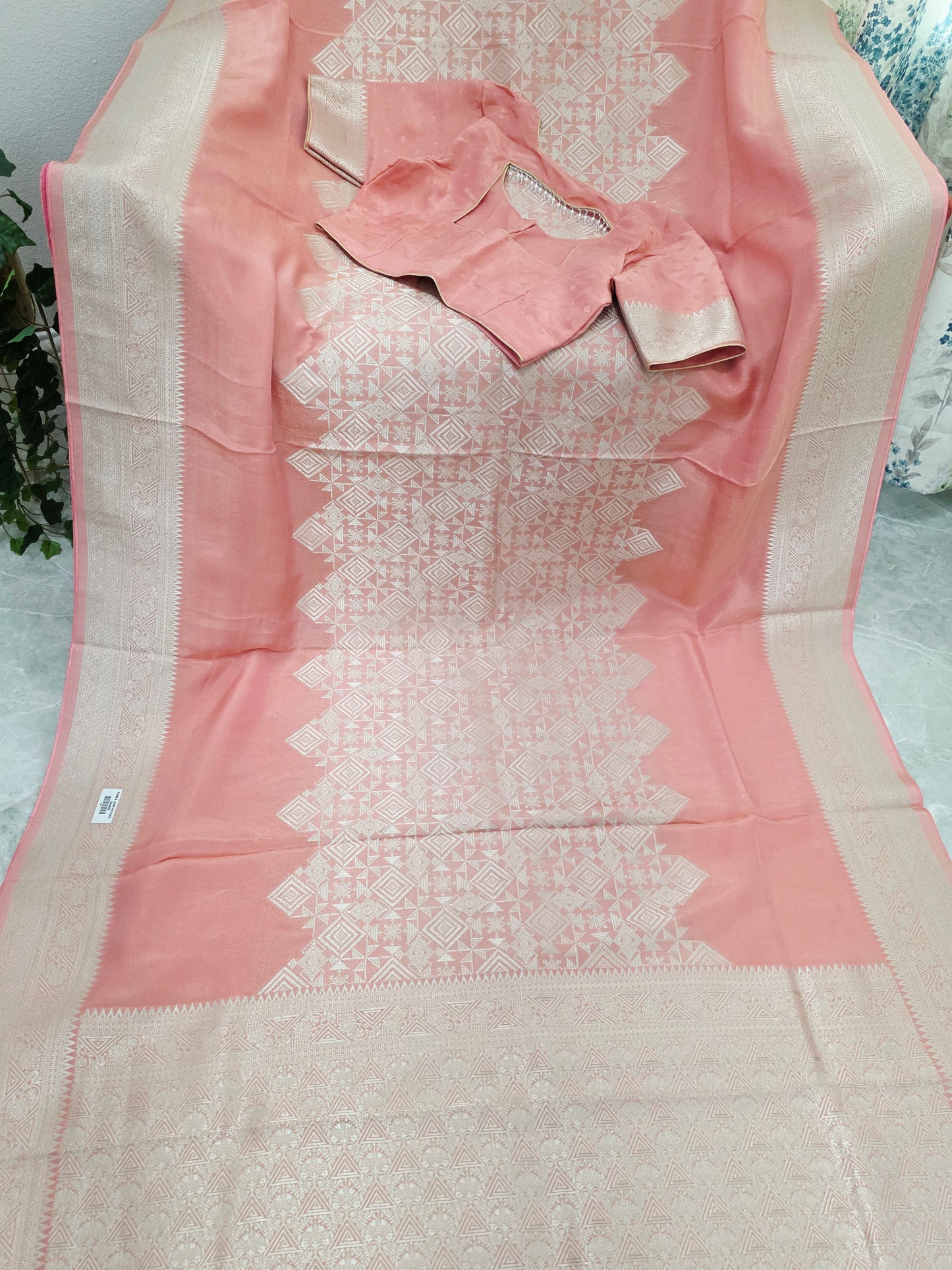 Pastel Coral Rose Soft Tissue Saree with Subtle Gold Geometry Center Design & Stitched Blouse
