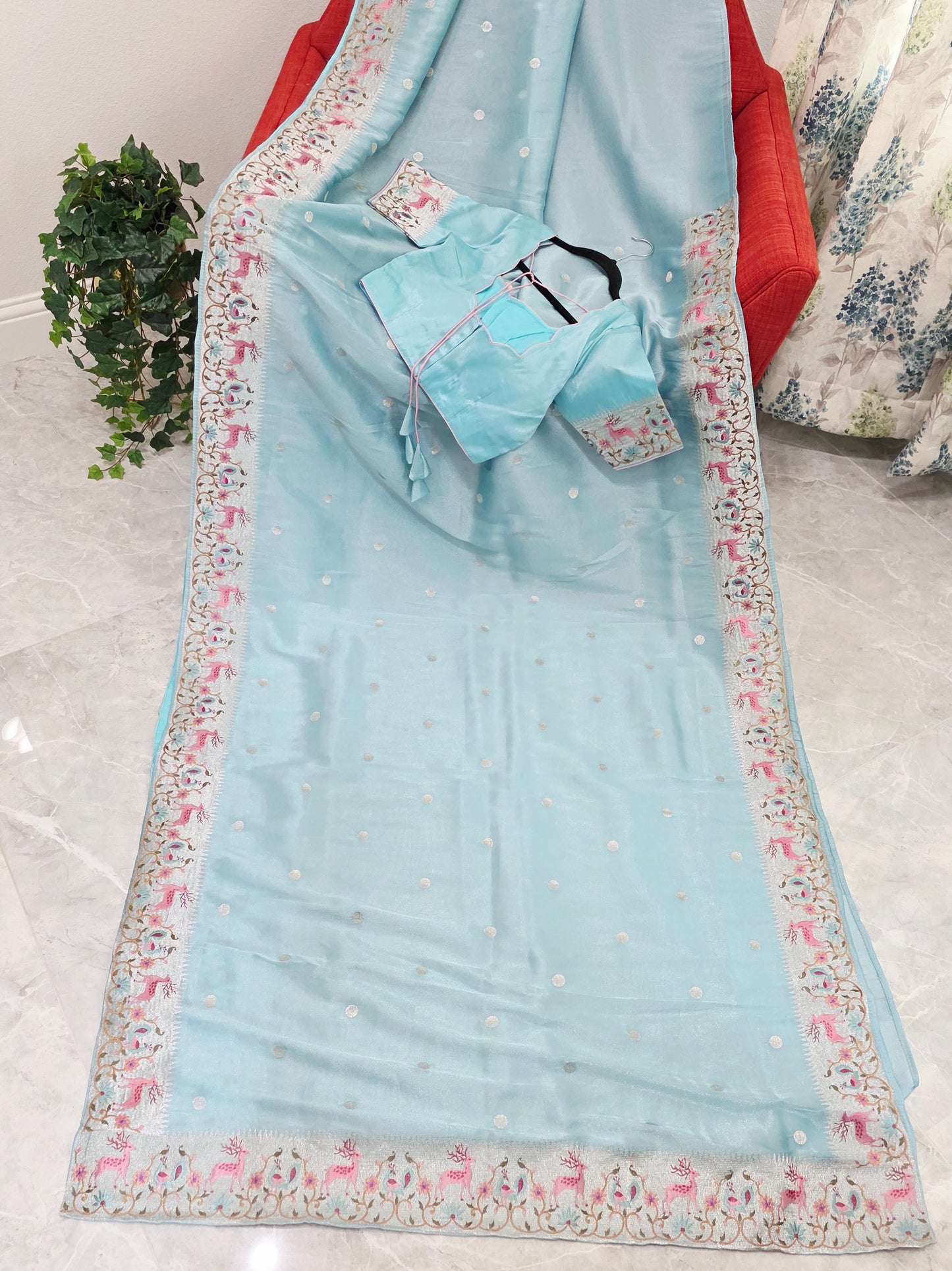 Aqua Blue Soft Tissue Silk Saree with Embroidered Border & Stitched Blouse