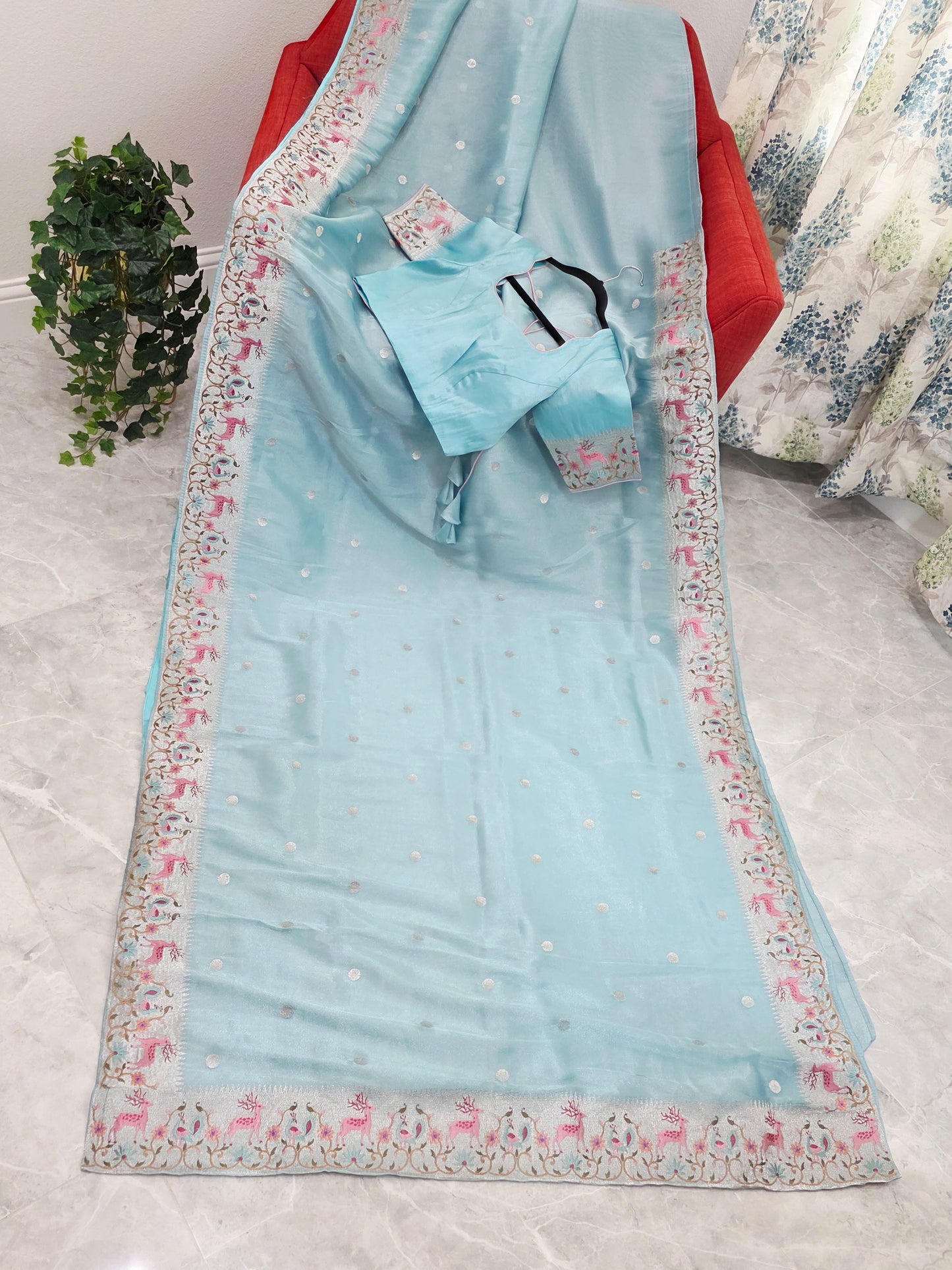 Aqua Blue Soft Tissue Silk Saree with Embroidered Border & Stitched Blouse