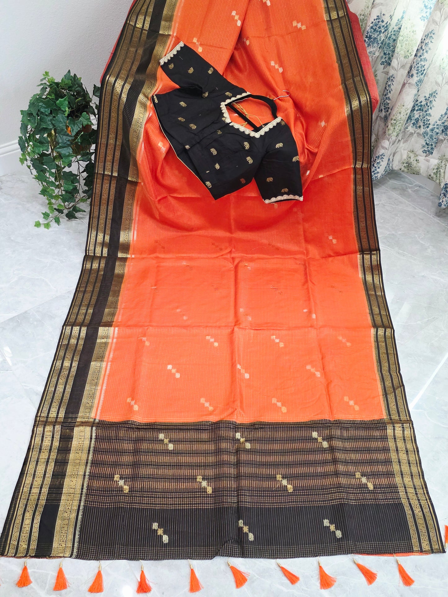 Royal Coral Orange Russian Dola Crepe Silk Saree with Black Gold Zari Border & Elephant Butta Stitched Blouse