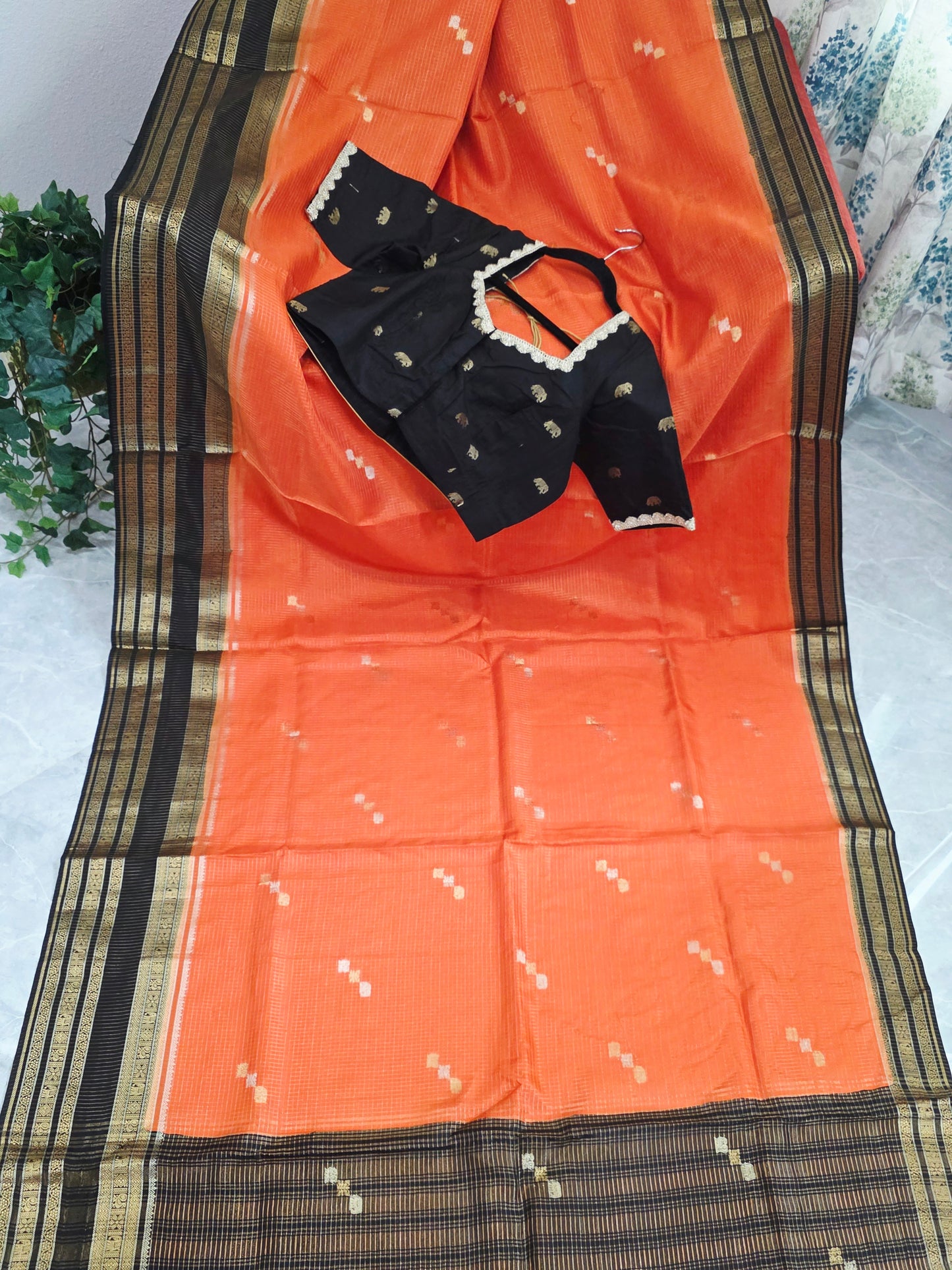 Royal Coral Orange Russian Dola Crepe Silk Saree with Black Gold Zari Border & Elephant Butta Stitched Blouse