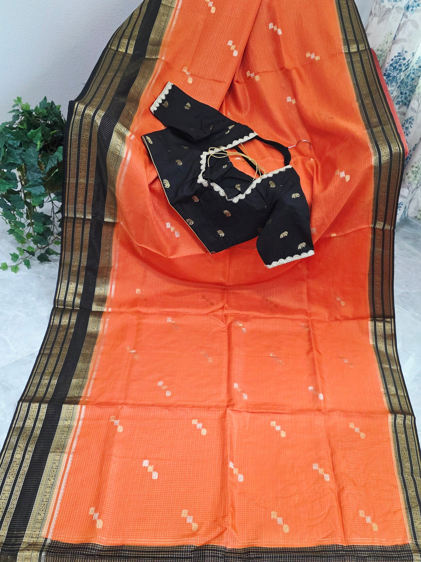 Royal Coral Orange Russian Dola Crepe Silk Saree with Black Gold Zari Border & Elephant Butta Stitched Blouse
