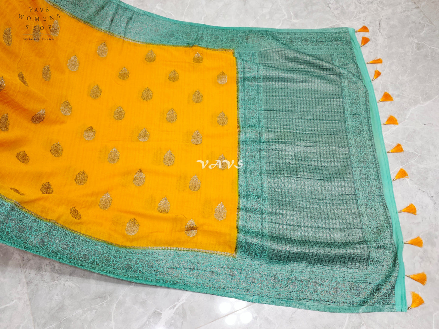 Regal Marigold & Turquoise Semi Tussar Georgette Saree with Antique Silver Zari Buttas & Puff-Sleeve Blouse